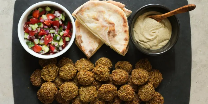 Crispy falafel plate with hummus and Mediterranean mezze sides