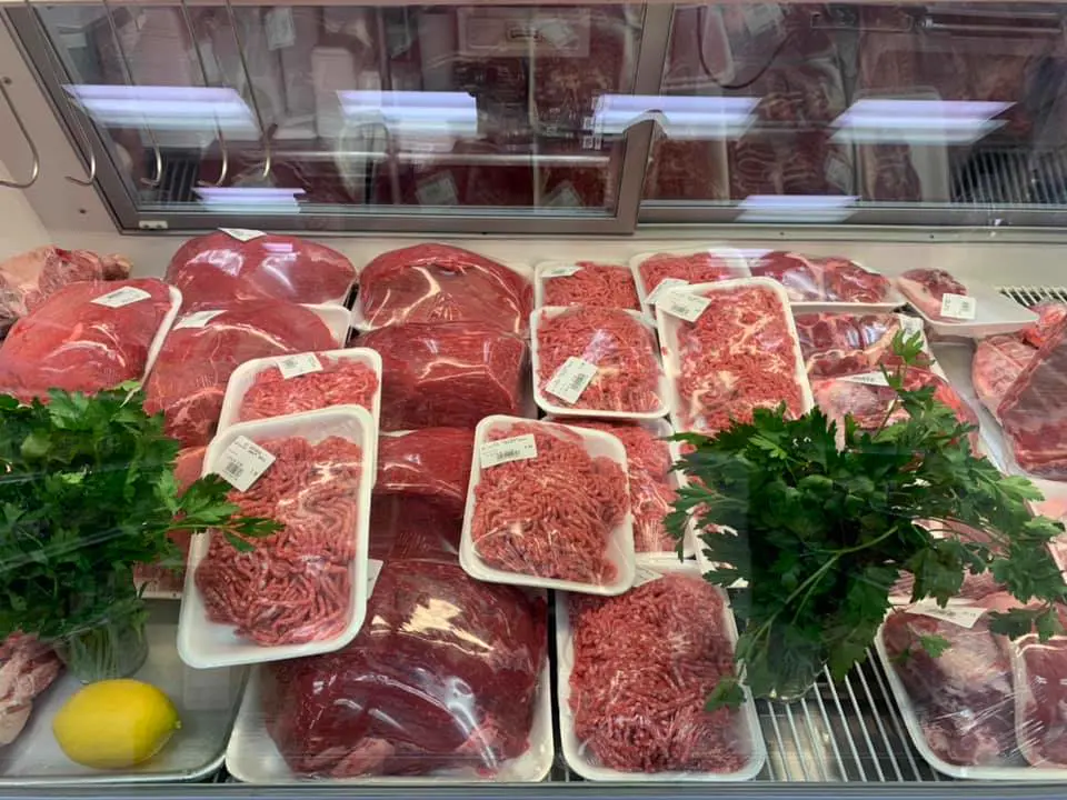 Halal butcher counter with fresh meats at Al Baraka Market Raleigh
