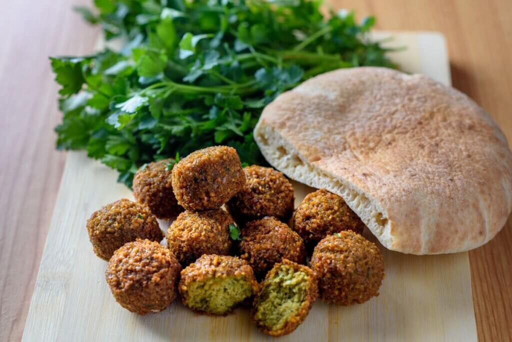 In this image you will see a most famous and the most delicious Mediterranean dish called falafels