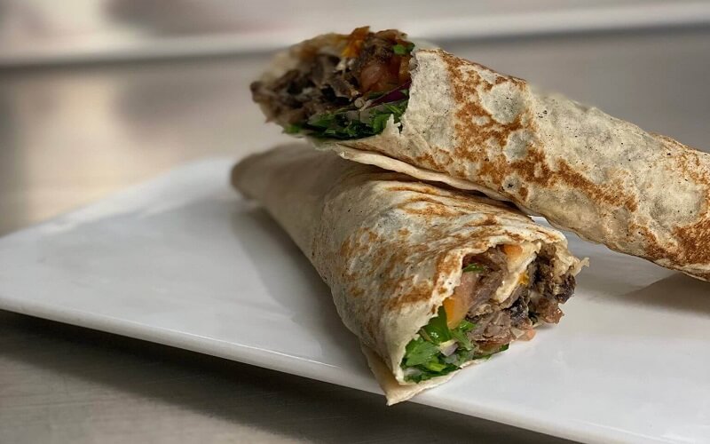 This image you will see a middle eastern famous dish called Shawarma