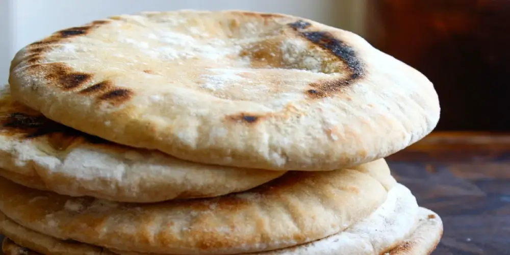 Pieces of mediterranean bread stacked on top of each other